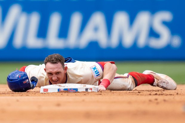 Phillies outfielder Austin Hays slides safely into second on a double against the Yankees on July 31, 2024, in Philadelphia. (Chris Szagola/AP)