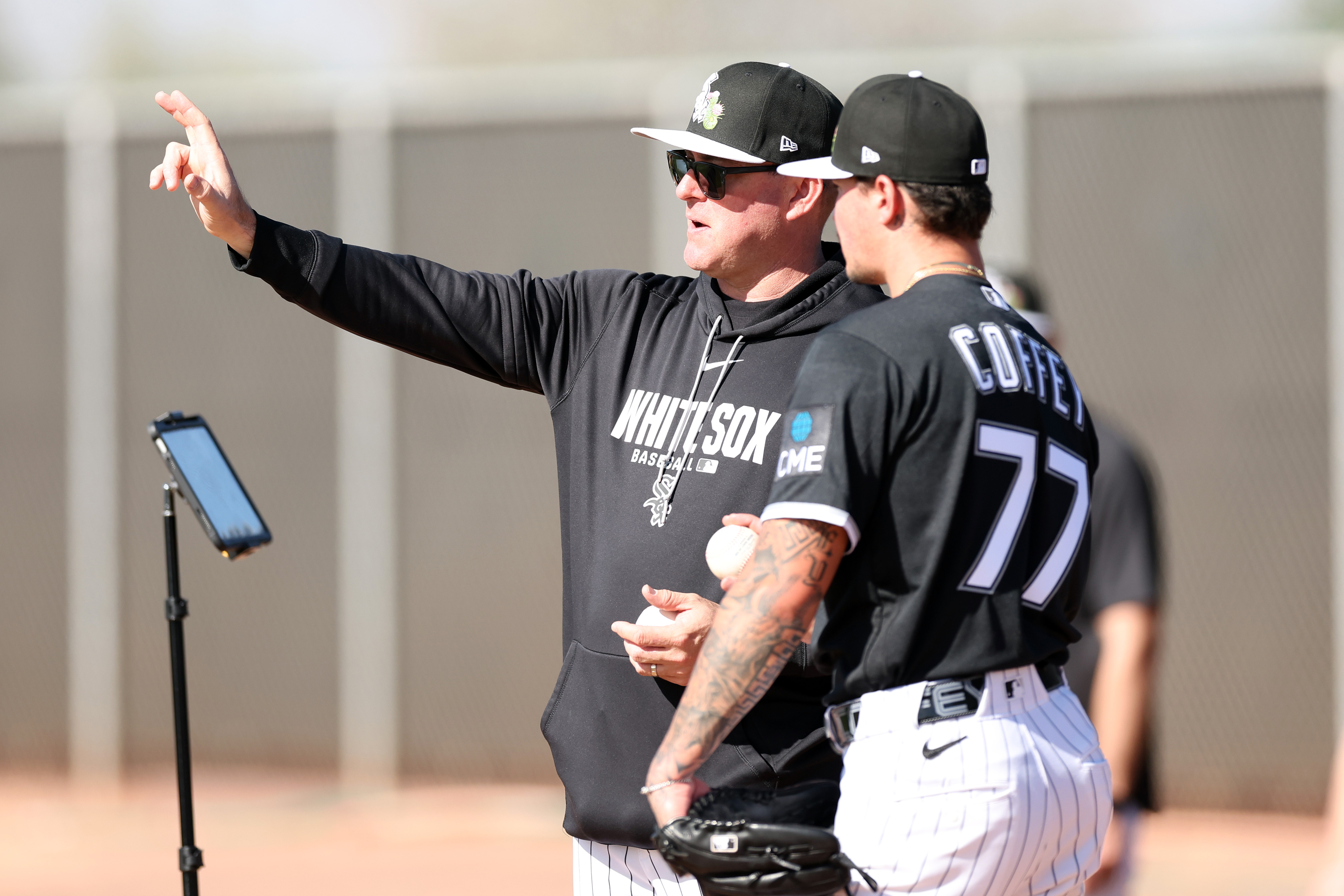 White Sox senior adviser to pitching Brian Bannister talks with...