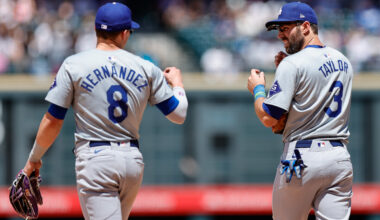 Los Angeles Dodgers third baseman Kike Hernandez (8) and second baseman Chris Taylor (3) in the fifth inning against the Colorado Rockies at Coors Field.