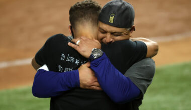 Los Angeles Dodgers manager Dave Roberts celebrating the 2020 World Series with his son, Cole Roberts.
