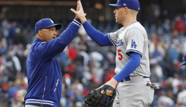 Los Angeles Dodgers manager Dave Roberts (30) celebrates with Dodgers first baseman Freddie Freeman (5) after their game against the Washington Nationals at Nationals Park.