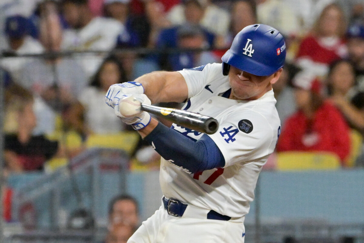 Los Angeles Dodgers catcher Ben Rortvedt (47) hits a double against the Cincinnati Reds in the third inning during game two of the Wildcard round for the 2025 MLB playoffs at Dodger Stadium.
