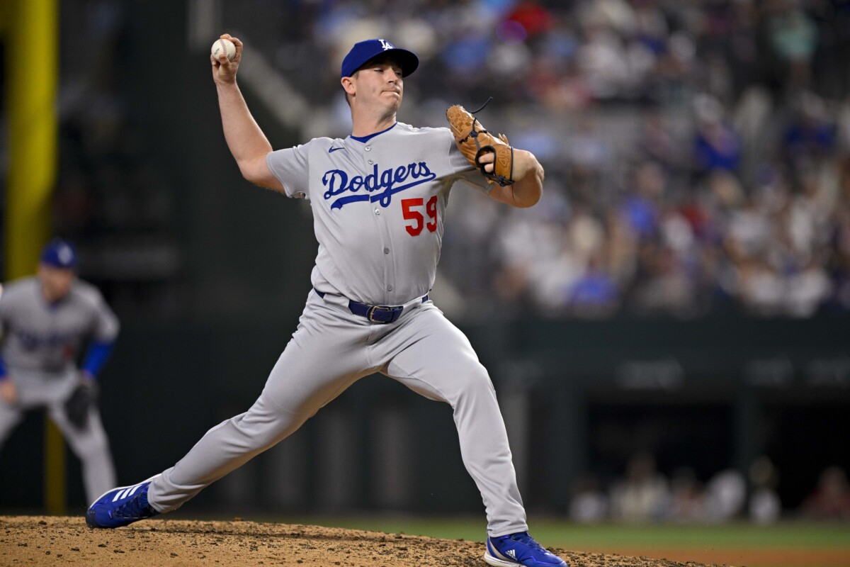 Apr 20, 2025; Arlington, Texas, USA; Los Angeles Dodgers relief pitcher Evan Phillips (59) pitches during the game between the Texas Rangers and the Los Angeles Dodgers at Globe Life Field. Mandatory Credit: Jerome Miron-Imagn Images