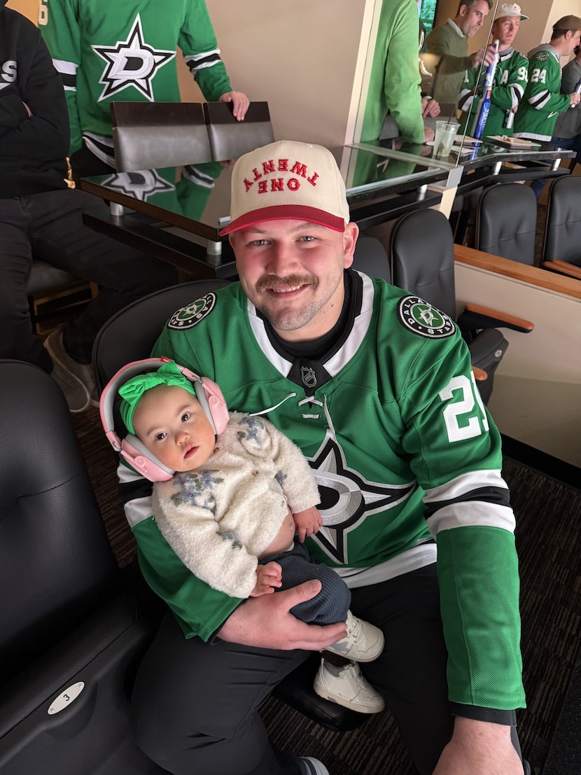 Texas Rangers first baseman Jake Burger is pictured with daughter Penelope, 1, at a Dallas...