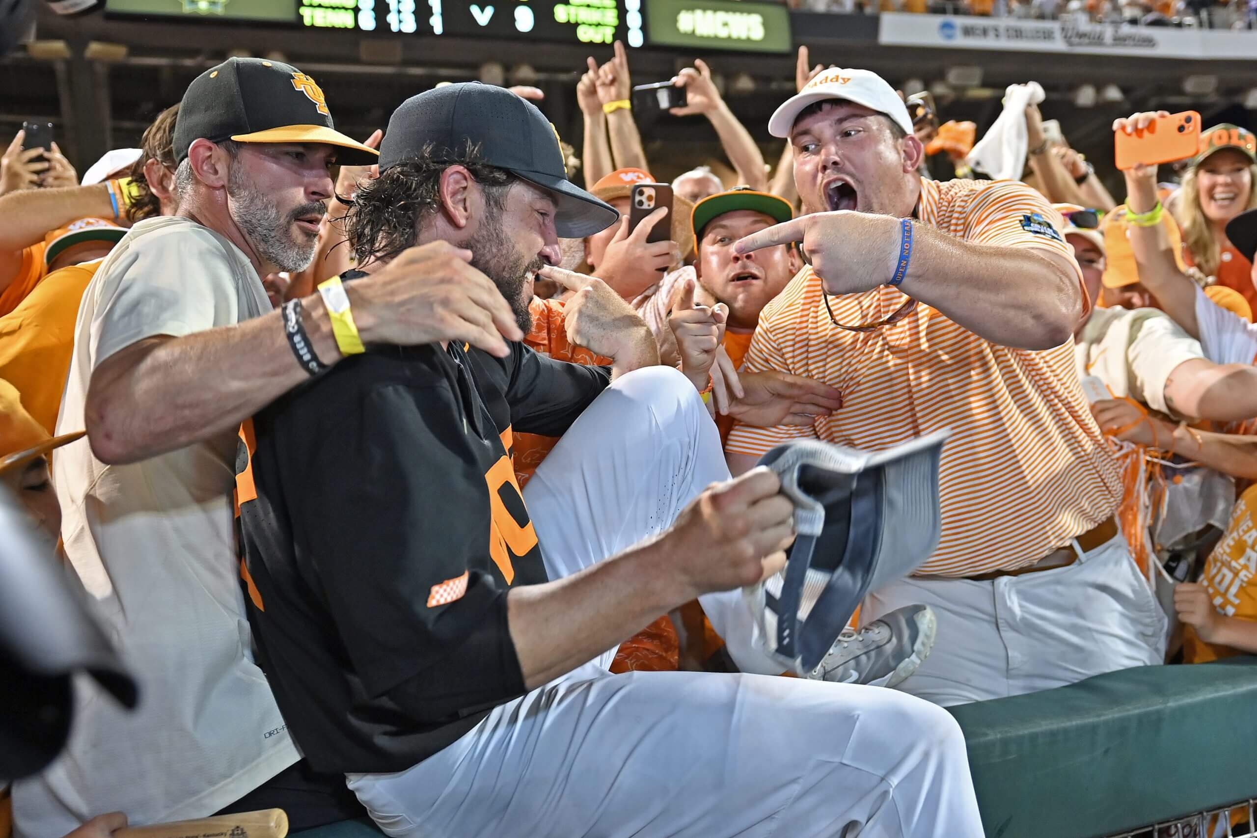 Head coach Tony Vitello (C) of the Tennessee Volunteers celebrates with fans after defeating the Texas A&M Aggies for the national championship in the NCAA Division I Baseball Championship on June 24, 2024 at Charles Schwab Field in Omaha, Nebraska.