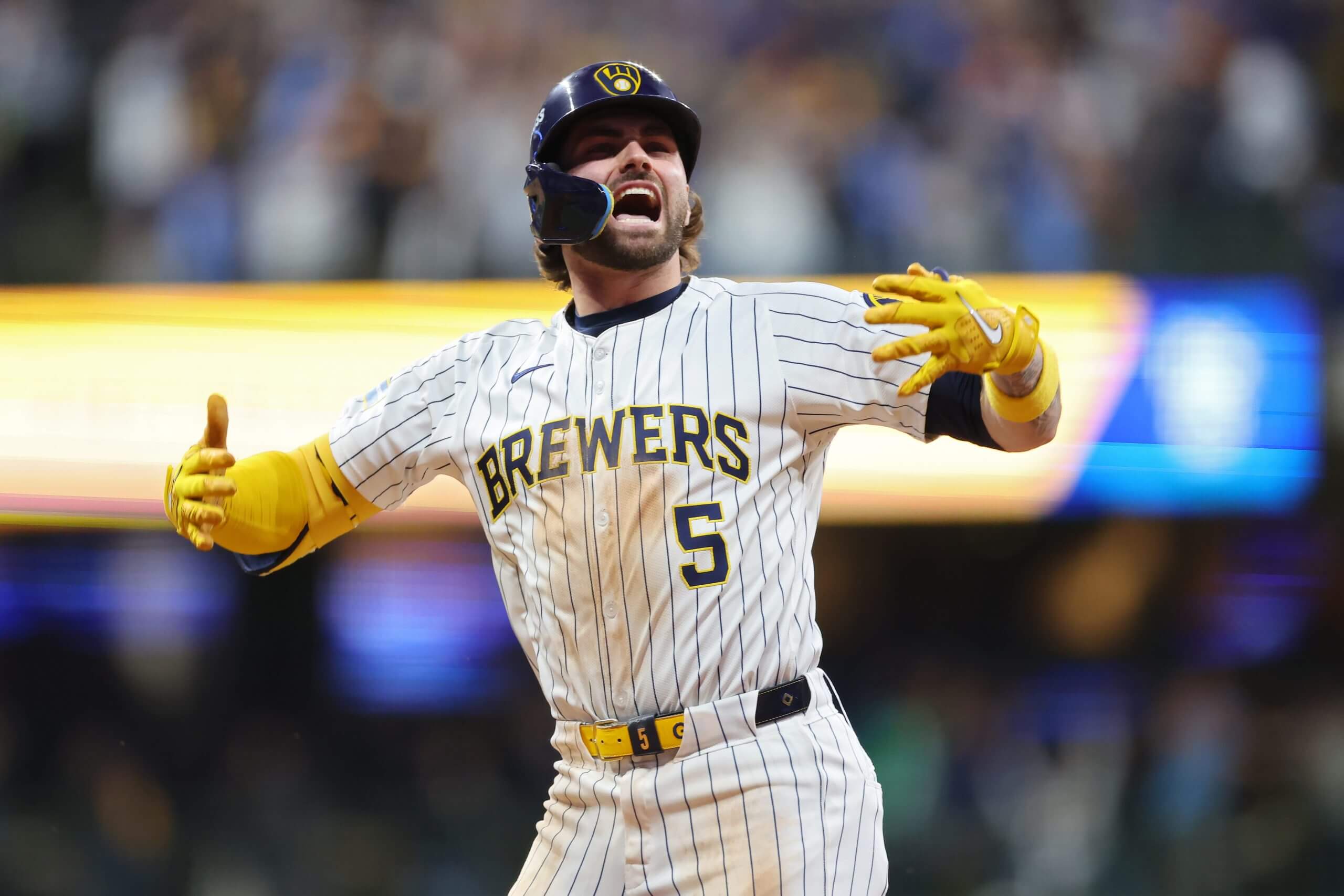Garrett Mitchell #5 of the Milwaukee Brewers celebrates after hitting a home run in the eighth inning against the New York Mets during Game Two of the Wild Card Series at American Family Field on October 02, 2024 in Milwaukee, Wisconsin.