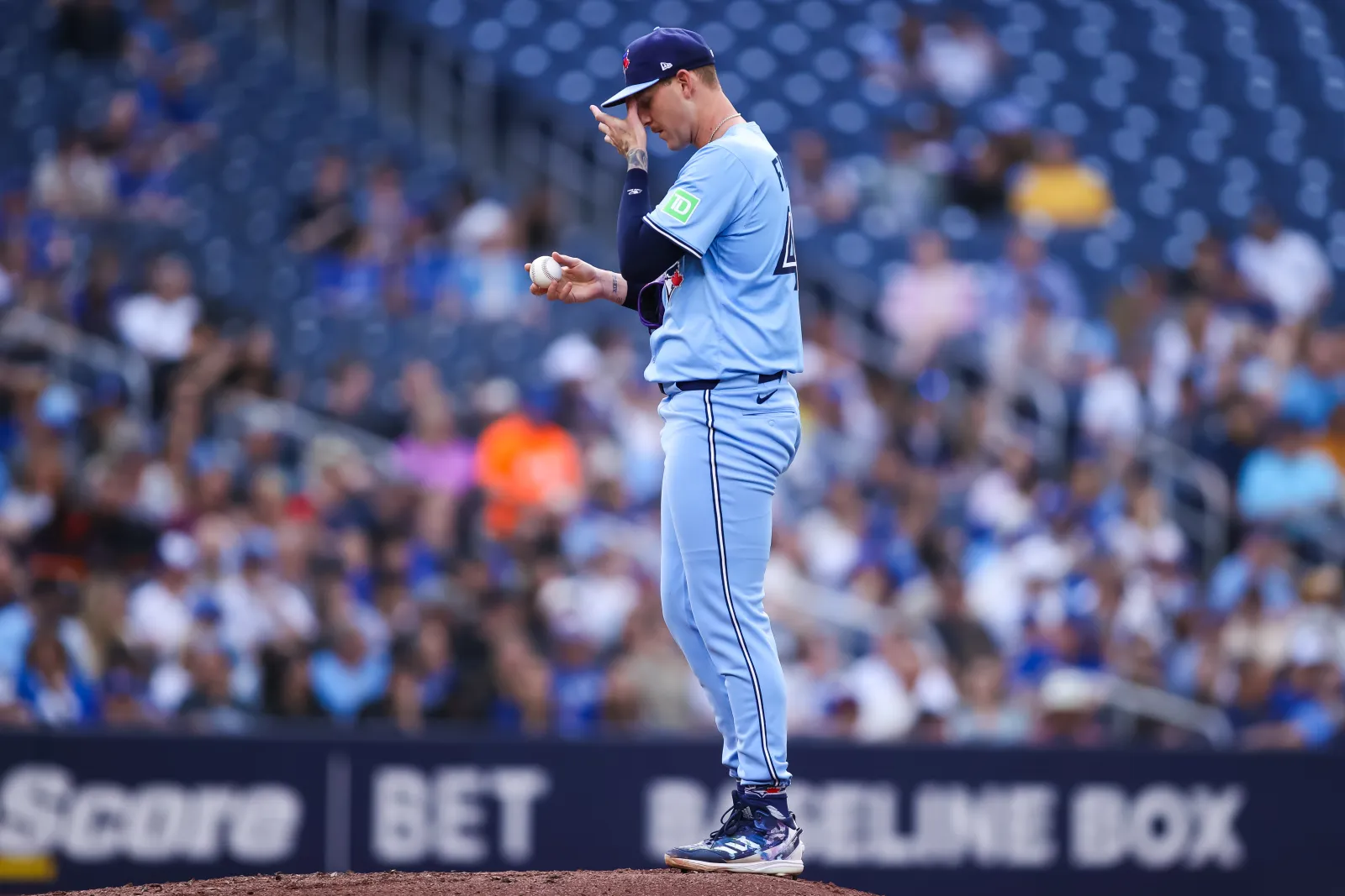 TORONTO, CANADA - JUNE 3: Bowden Francis #44 of the Toronto Blue Jays pauses before pitching in the first inning against the Philadelphia Phillies at Rogers Centre on June 3, 2025 in Toronto, Ontario, Canada. (Photo by Cole Burston/Getty Images)