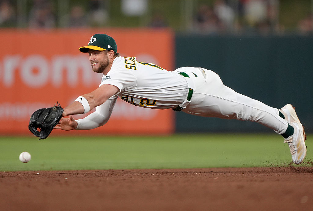 Athletics trade INF Schuemann to Yankees for RHP Burgos
