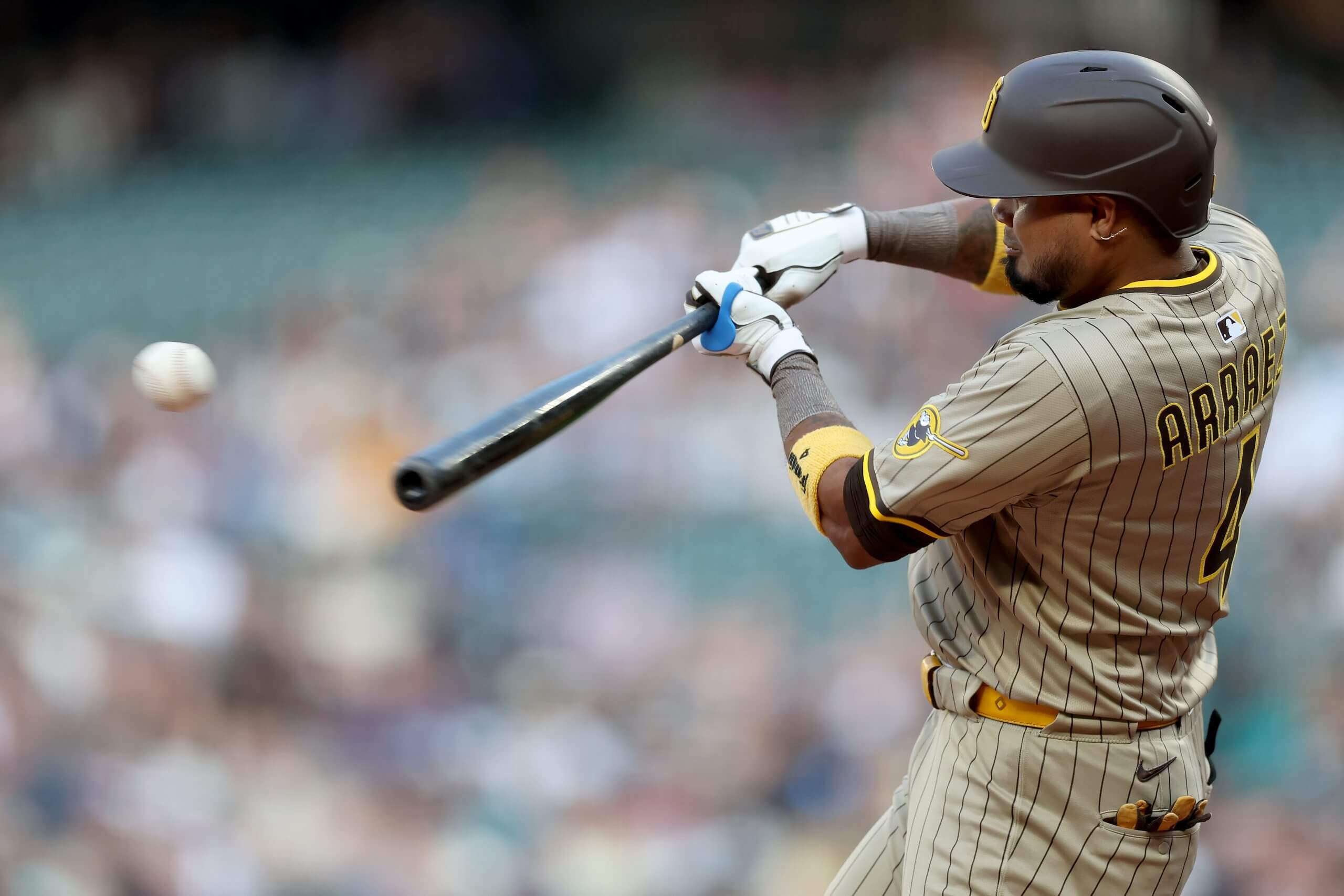 Luis Arraez hits a double at T-Mobile Park.