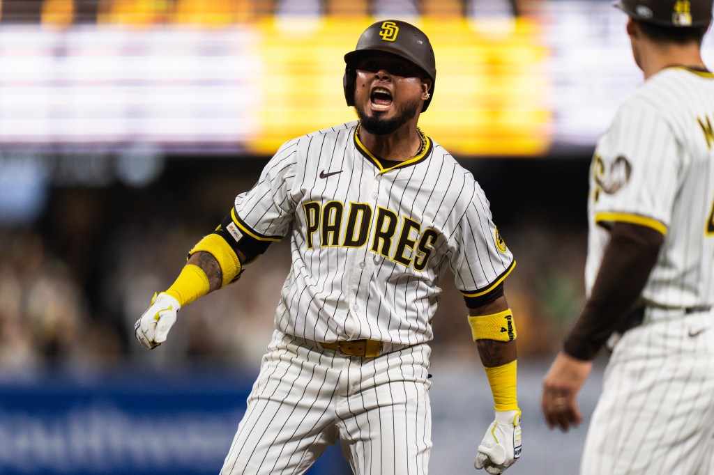 Luis Arraez #4 of the San Diego Padres celebrates after hitting a RBI single in the seventh inning the game against Milwaukee Brewers at Petco Park on September 22, 2025 in San Diego, California. 