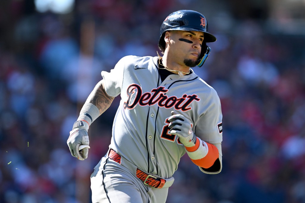 Javier Báez #28 of the Detroit Tigers runs to first base after hitting a single in the fifth inning against the Cleveland Guardians during game one of the American League Wild Card Series at Progressive Field on September 30, 2025 in Cleveland, Ohio.