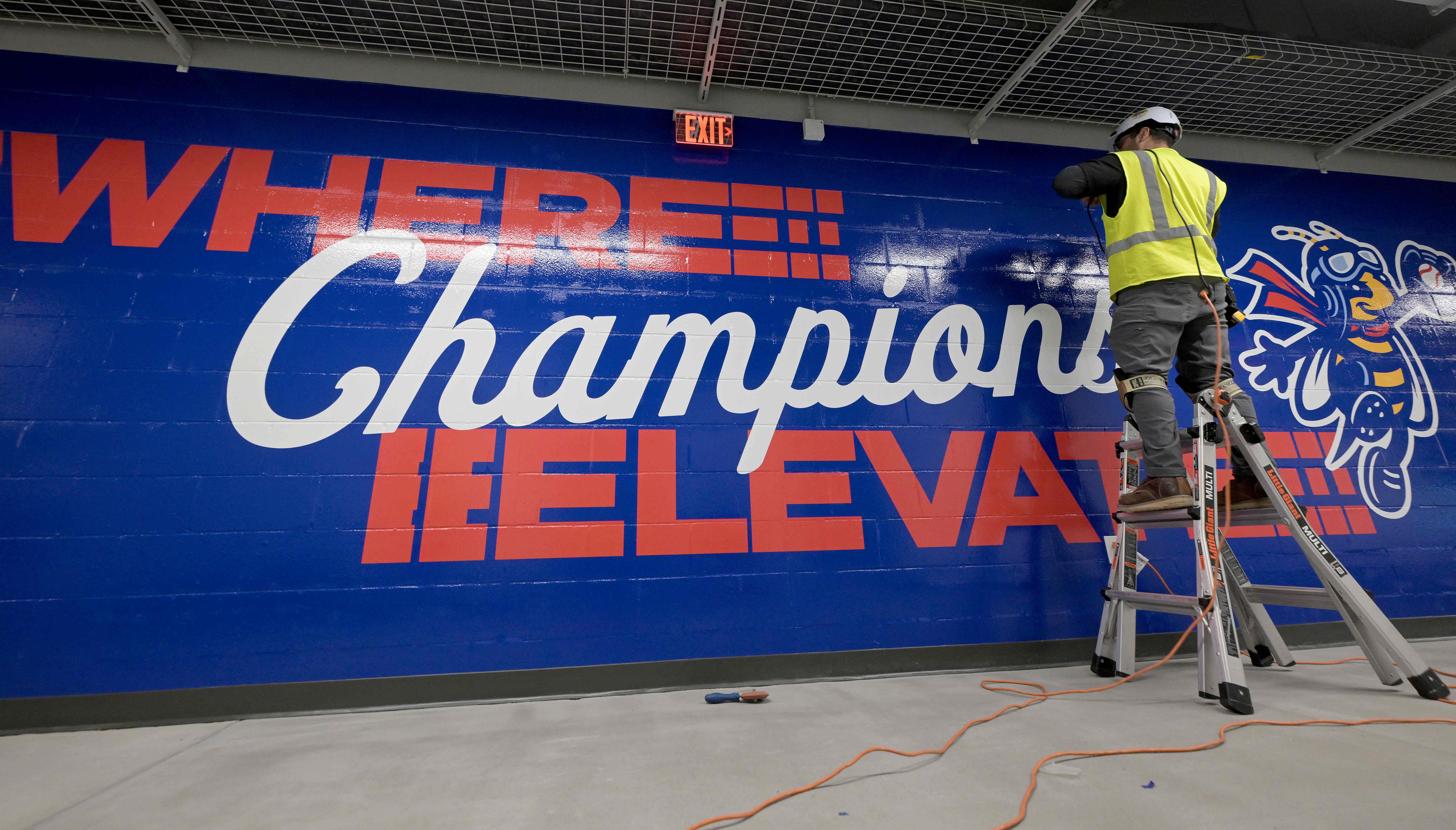 Ricardo Flores works Friday, Feb. 13, 2026, on a mural...