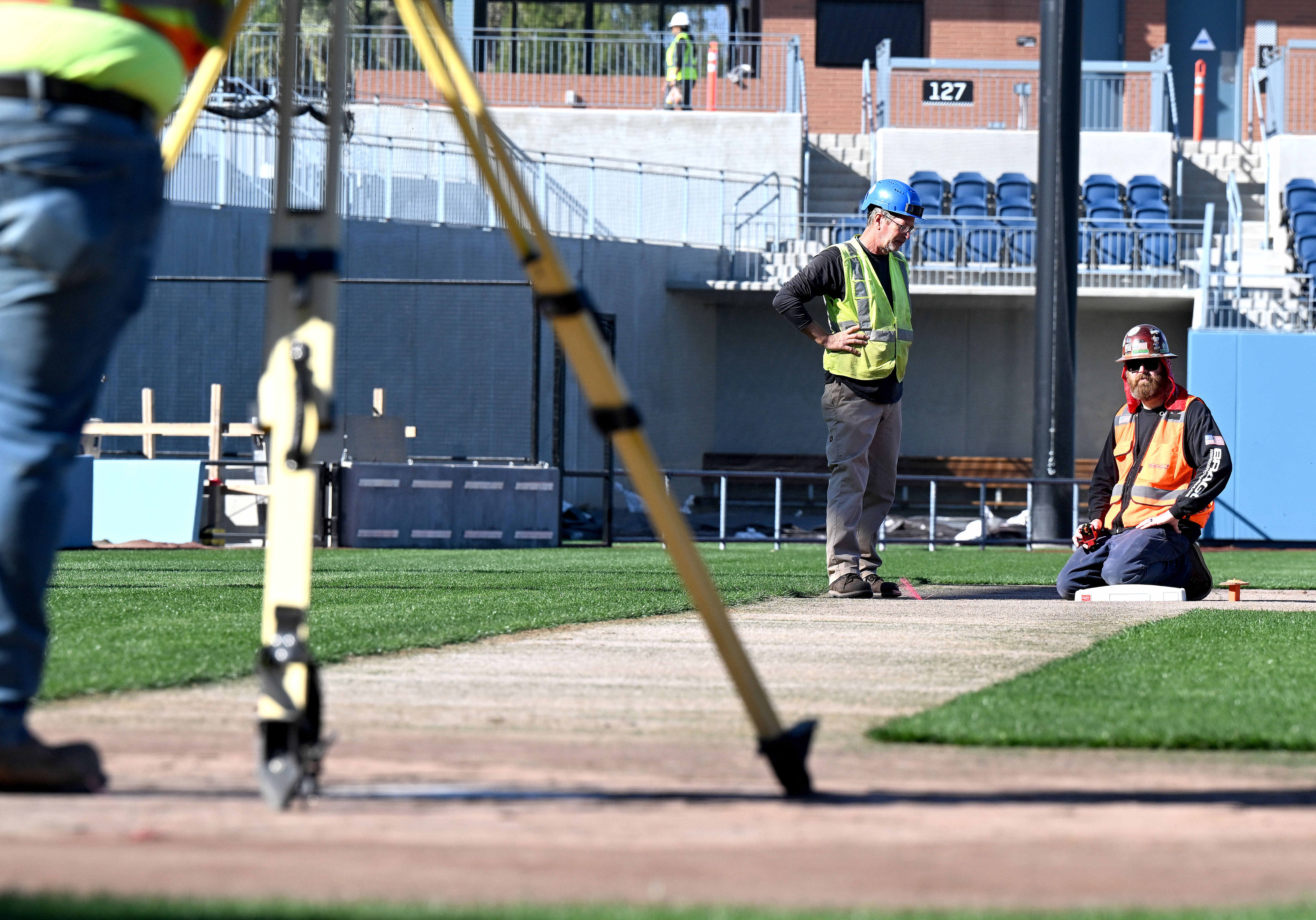 Workers measure the space between bases Friday, Feb. 13, 2026,...
