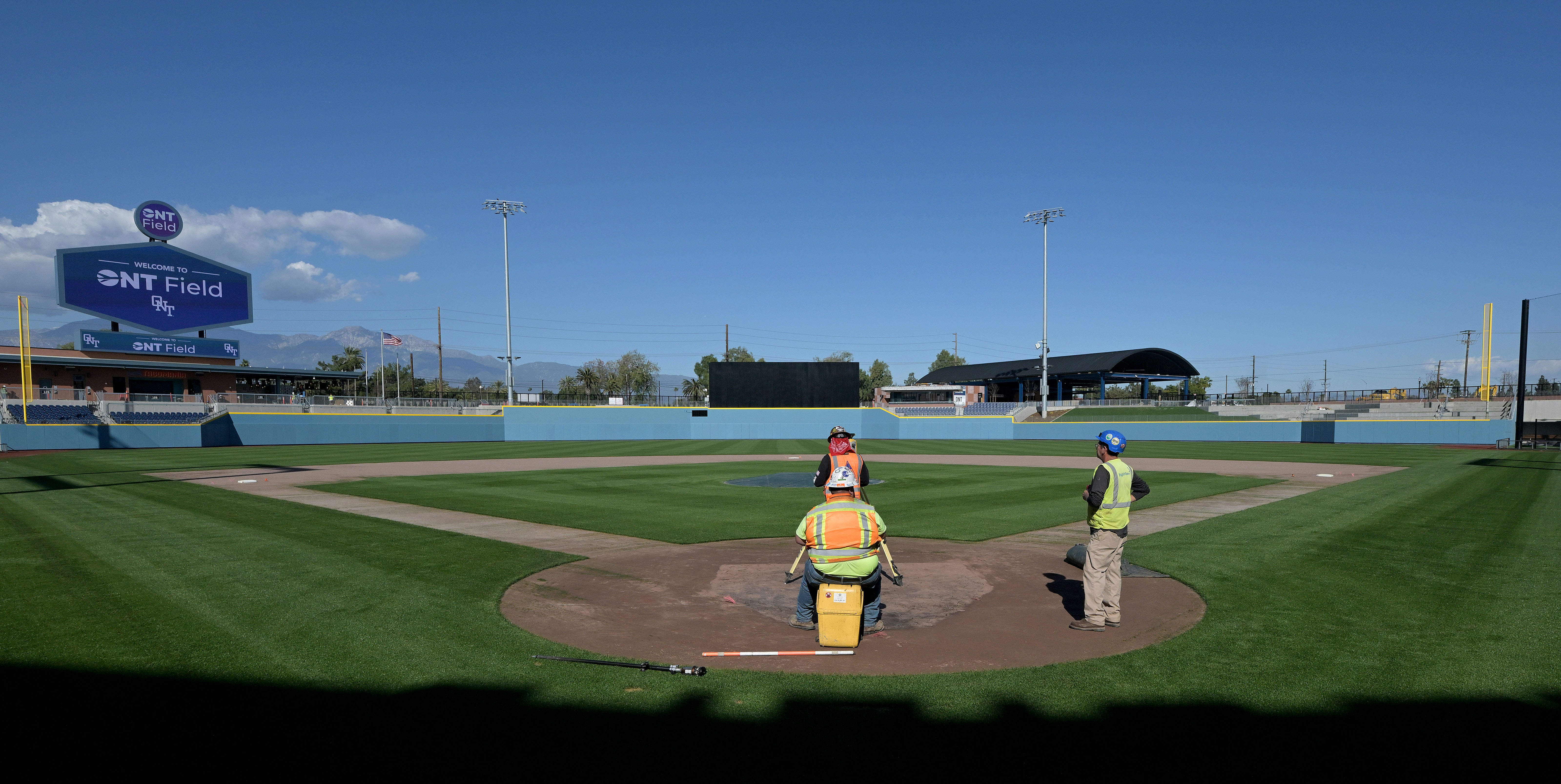 Workers measure the space between bases Friday, Feb. 13, 2026,...