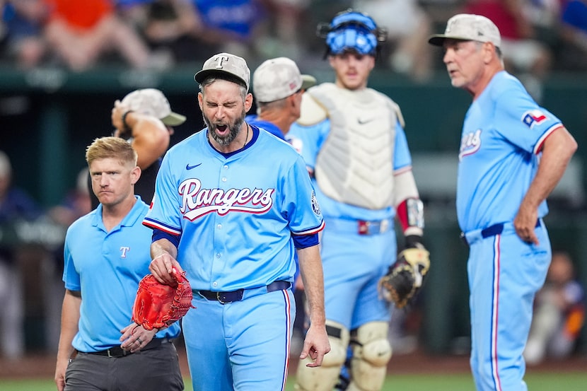 Texas Rangers pitcher Chris Martin yells as he leaves the game during the eighth inning...