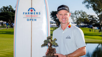 Feb 1, 2026; San Diego, California, USA; Justin Rose holds the Farmers Insurance trophy after winning the Farmers Insurance Open golf tournament at Torrey Pines Municipal Golf Course - South Course.