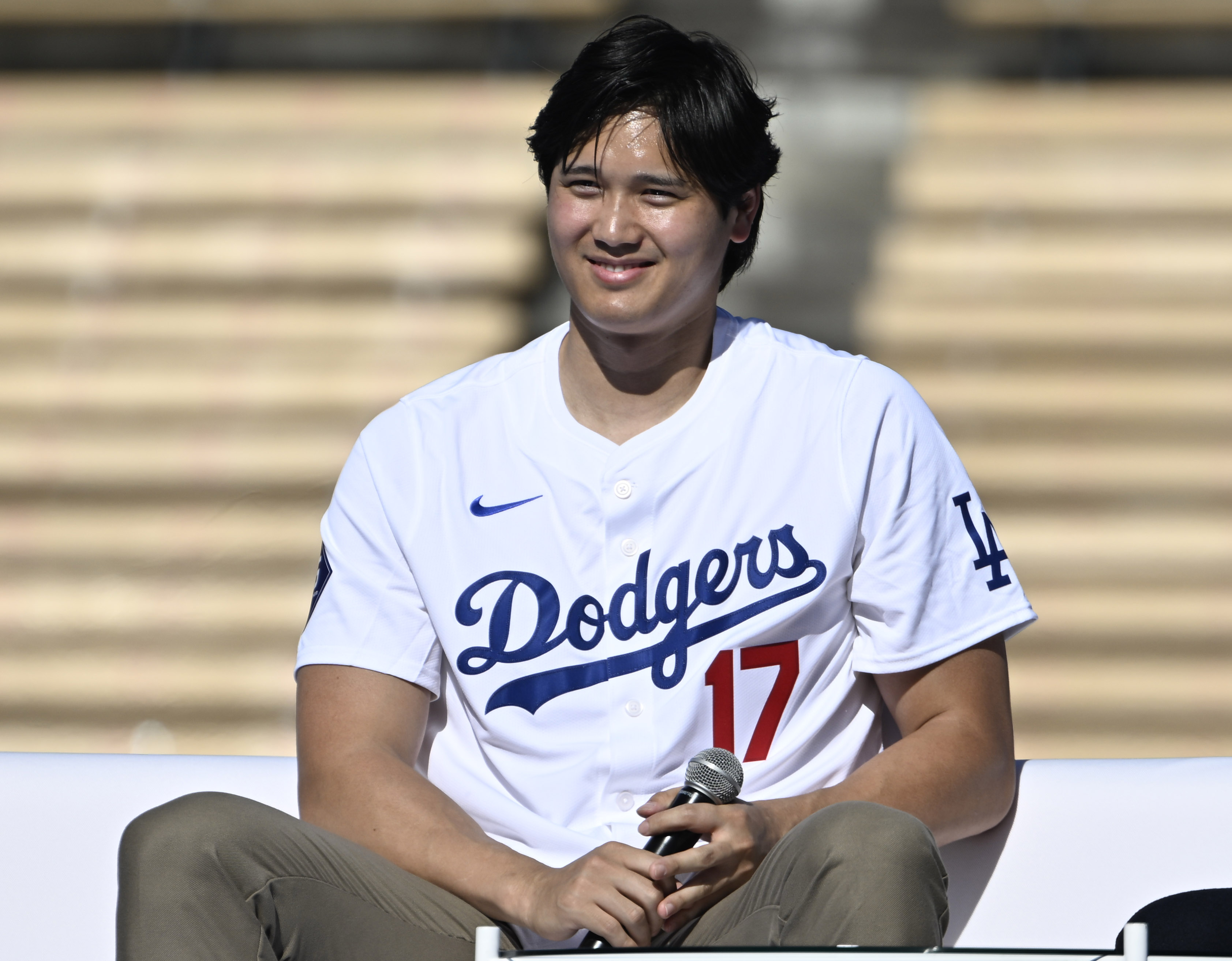 Shohei Ohtani #17 of the Los Angeles Dodgers smiles during...