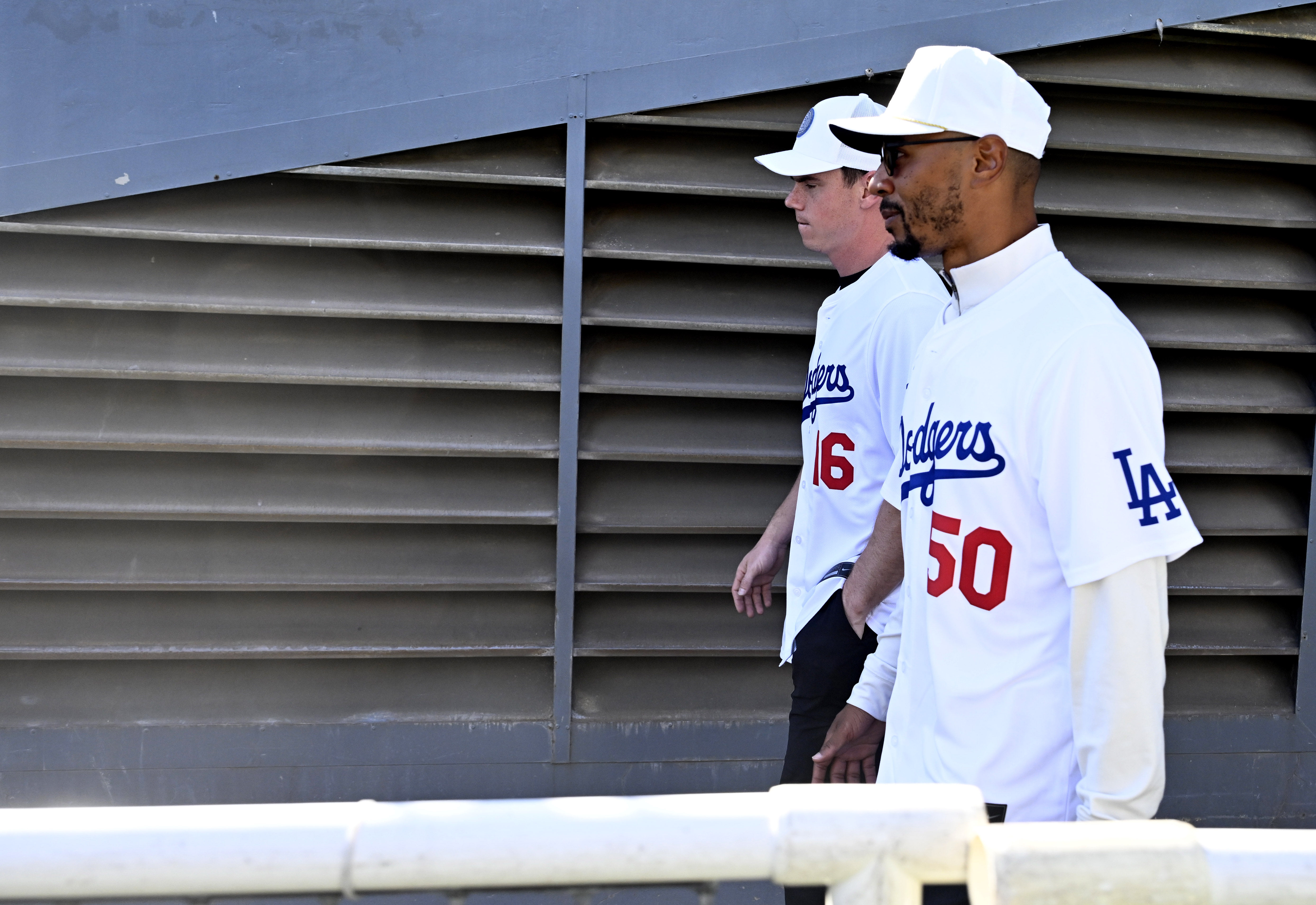 Will Smith, left, along with Mookie Betts make their way...