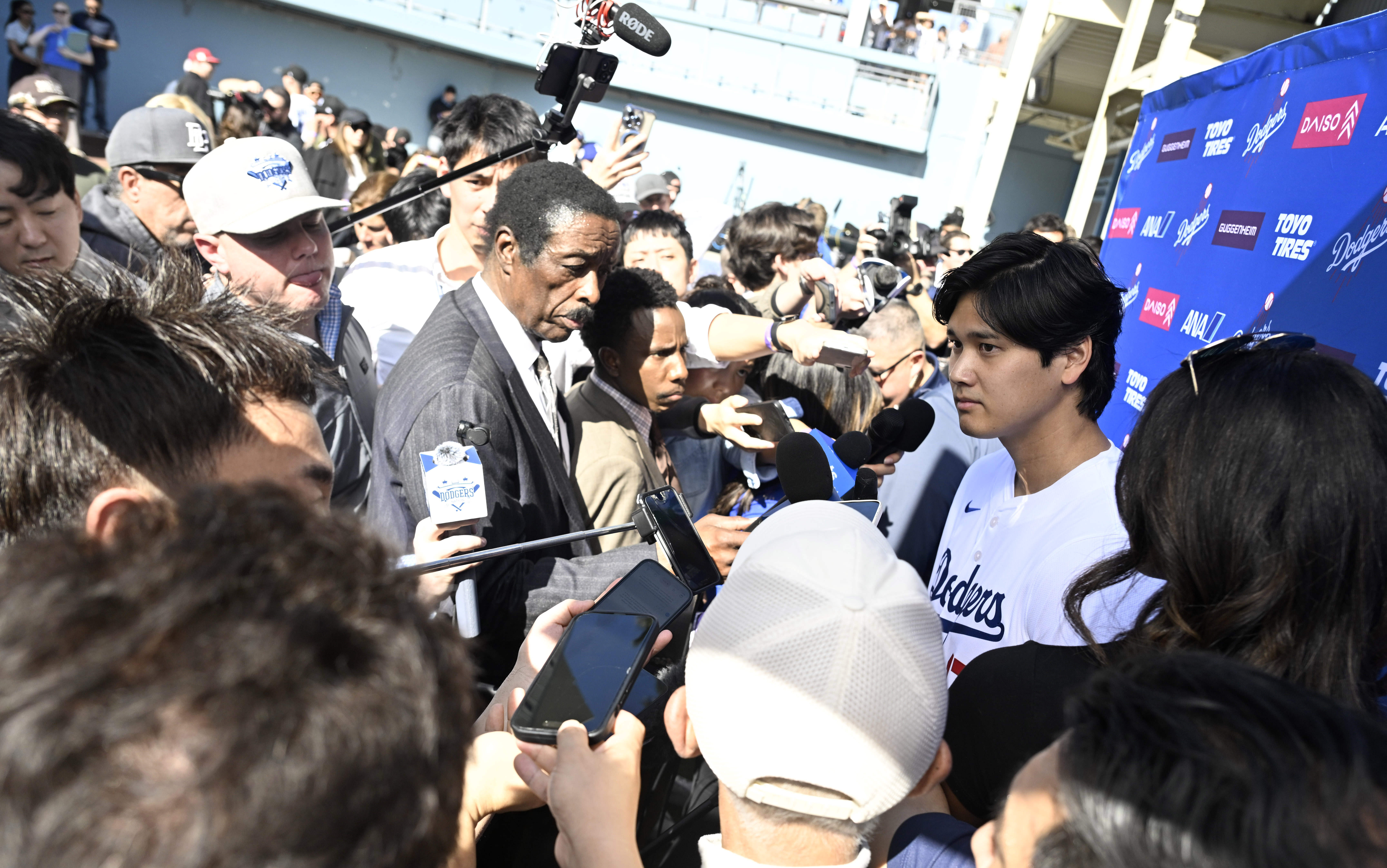 Shohei Ohtani of the Los Angeles Dodgers speaks to the...