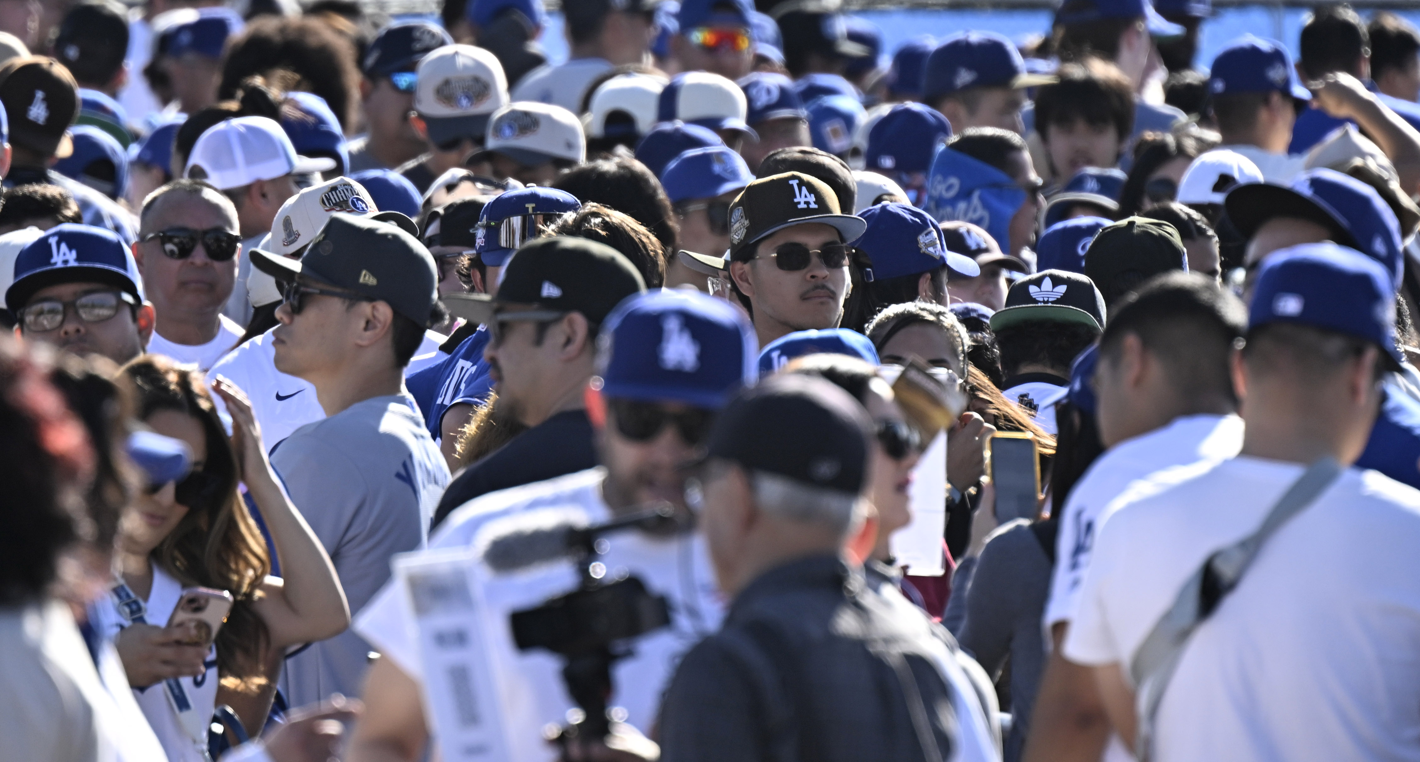 Hundreds of Dodger fans make their way during the annual...