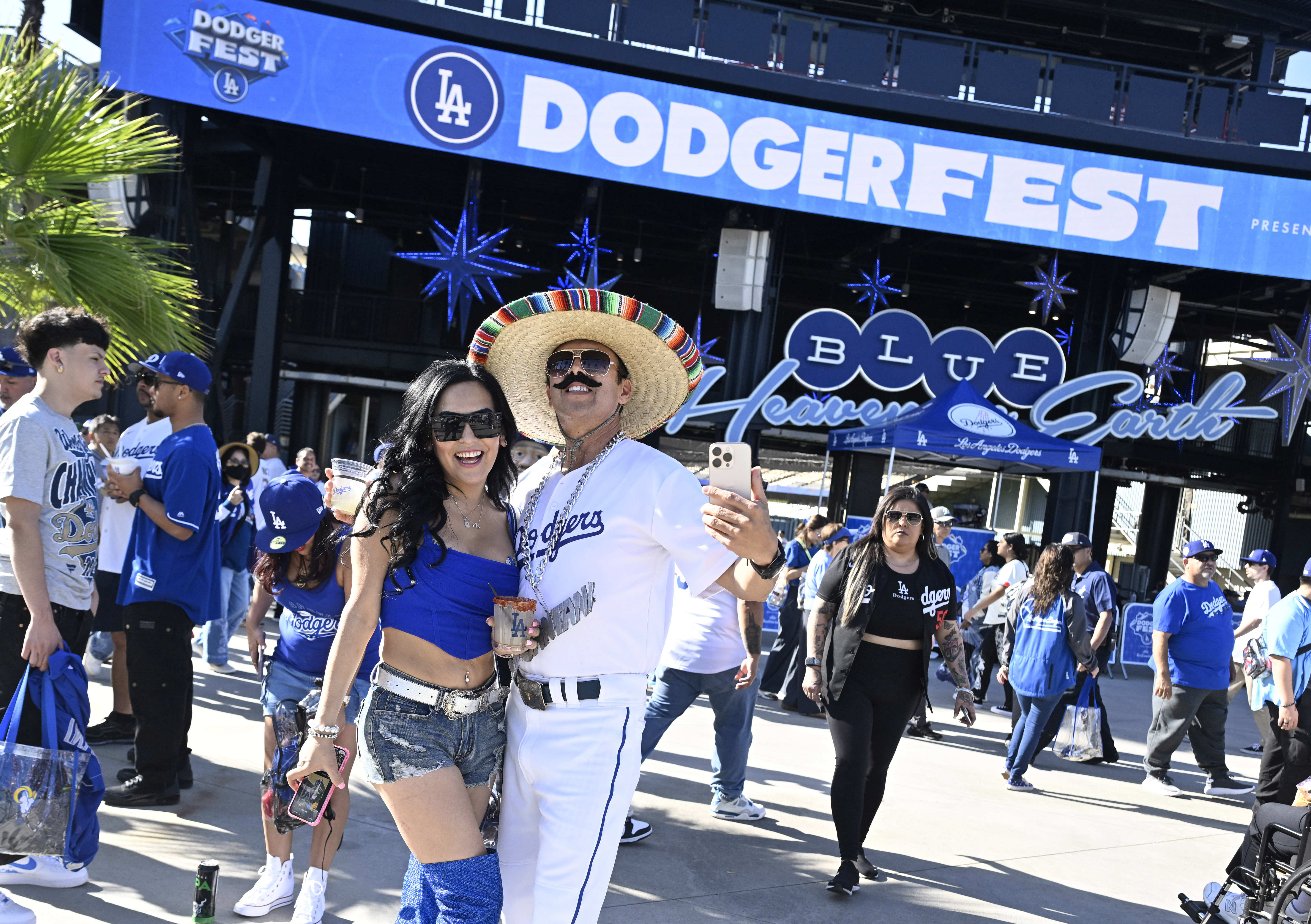 Dodger fan Juantani poses with fans during the annual DodgerFest...