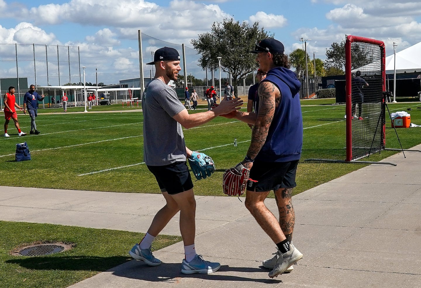 From left, Boston Red Sox shortstop Trevor Story (10) greeted Sox left fielder Jarren Duran (16) on Day 3 of Spring Training at Jet Blue Park, in Fort Myers, FL.