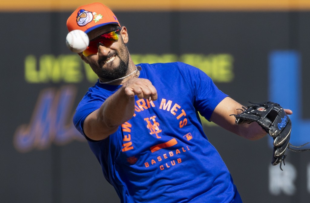 Marcus Semen makes a throw after fielding a ball during Mets' spring training on Feb. 14, 2026.