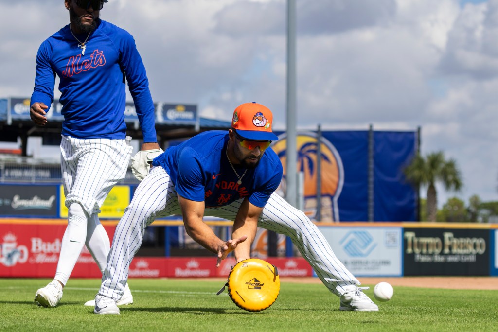 Second baseman Marcus Semien works in a fielding drill during Mets' spring training on Feb. 14, 2026.Second baseman Marcus Semien works in a fielding drill during Mets' spring training on Feb. 14, 2026.