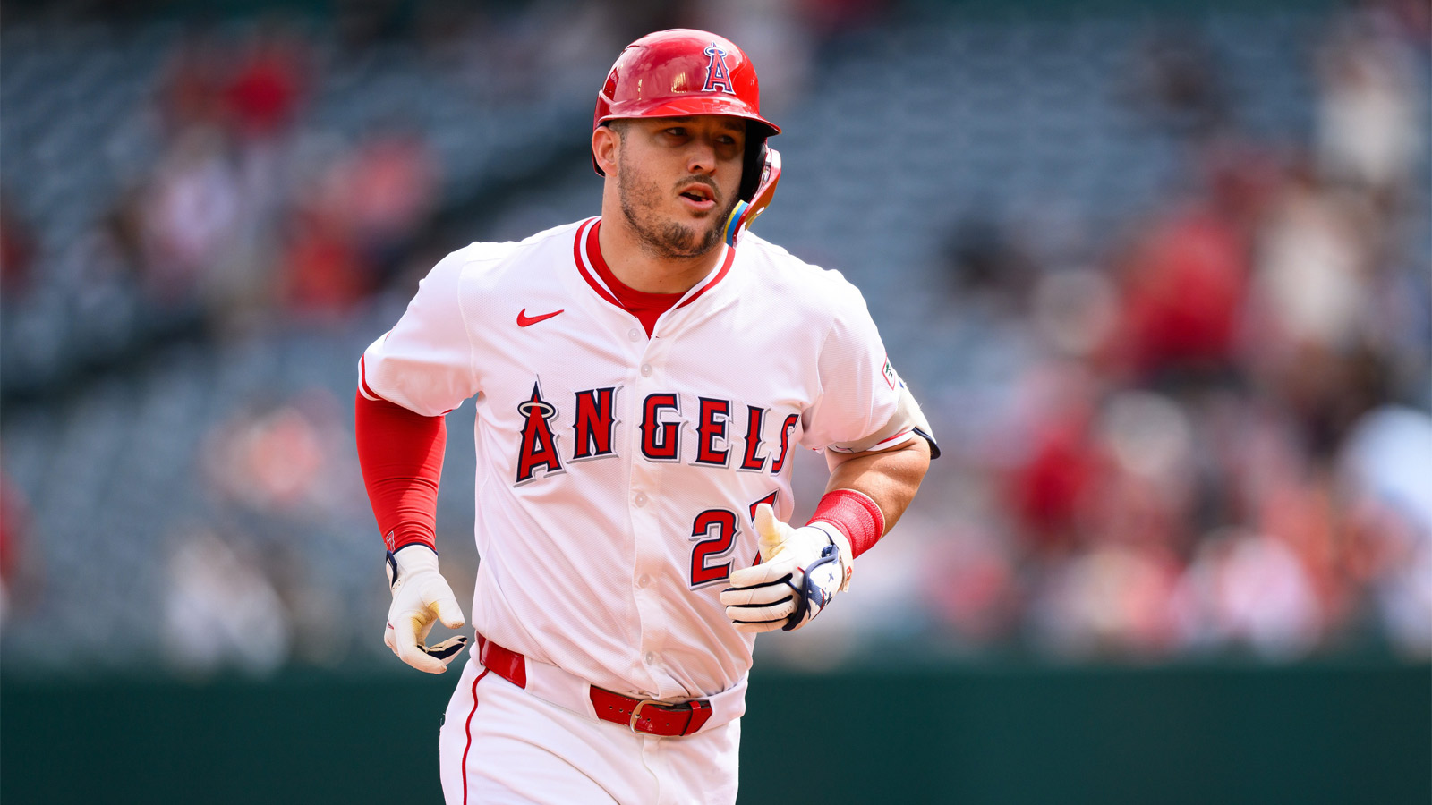 Los Angeles Angels designated hitter Mike Trout (27) runs after hitting a home run during the first inning against the Houston Astros at Angel Stadium.
