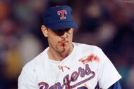Texas Rangers pitcher Nolan Ryan suffered a bloody lip when hit by a one-hop bouncer off the...