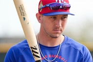 Texas Rangers outfielder Wyatt Langford prepares to take batting practice during a spring...