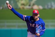 Texas Rangers pitcher Nathan Eovaldi delivers during the first inning of a spring training...