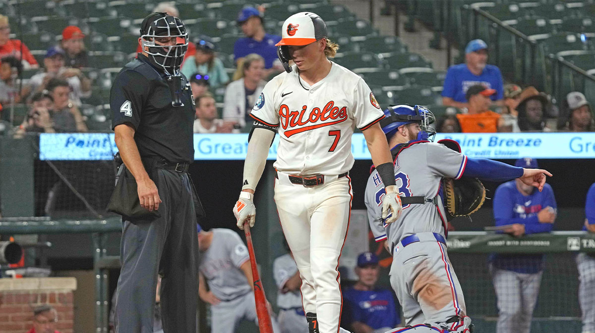 Jun 25, 2025; Baltimore, Maryland, USA; Baltimore Orioles second baseman Jackson Holliday (7) takes a called third strike during the ninth inning against the Texas Rangers at Oriole Park at Camden Yards.