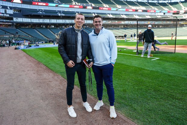 Jack McMullen, right, a 2016 Oak Park and River Forest High School graduate, stands with producer and pregame host Stephen Strom, before a 2025 Miami Marlins game against the White Sox at Rate Field in Chicago. McMullen is starting his for his second season as the play-by-play announcer for the Miami Marlins Radio Network. (Jack McMullen)