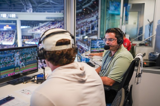 Jack McMullen, right, a 2016 Oak Park and River Forest High School graduate, calls a 2025 Miami Marlins game against the New York Yankees as the play-by-play announcer for the Miami Marlins Radio Network. (Jack McMullen)
