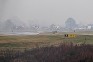 First responders tend to the scene of a reported plane crash at a regional airport in...