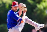 Texas Rangers pitcher MacKenzie Gore delivers during the first inning of a spring training...