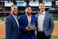 Texas Rangers minor league pitcher David Davalillo (center) is presented with the 2025 Nolan...