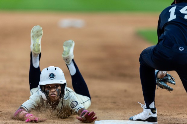 Thornwood's Amira Hondras (3) slides into third on a. Steal during the Double Duty Classic at Rate Field in Chicago on Wednesday, July 2, 2025. (Vincent D. Johnson / for the Daily Southtown)
