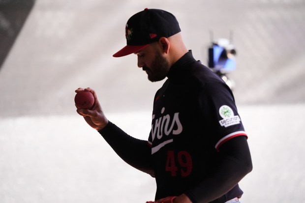 Minnesota Twins pitcher Pablo Lopez warms up during a spring training baseball workout in Fort Myers, Fla., Monday, Feb. 16, 2026. (AP Photo/Gerald Herbert)