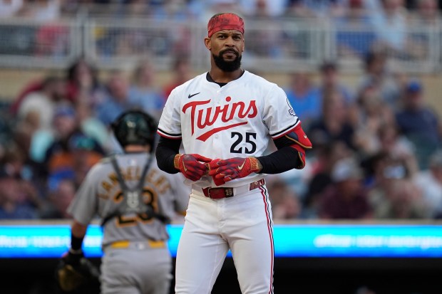 Minnesota Twins' Byron Buxton (25) stands at the plate after striking out to end the bottom of the third inning of a baseball game against the Athletics Tuesday, Aug. 19, 2025, in Minneapolis. (AP Photo/Abbie Parr)