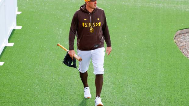 Padres manager Craig Stammen walks between drills during spring training on Wednesday at the Peoria Sports Complex. (Meg McLaughlin / The San Diego Union-Tribune)