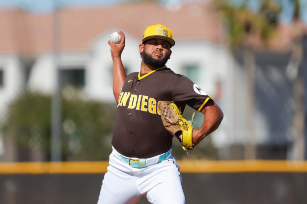 Randy Vasquez #98 of the San Diego Padres pitches during spring training workouts at the Peoria Sports Complex on Thursday, Feb. 12, 2026 in Peoria, Ariz.(Meg McLaughlin / The San Diego Union-Tribune)