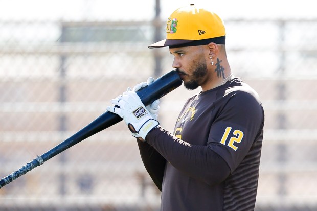 Luis Campusano #12 of the San Diego Padres kisses his bat before batting practice at the Peoria Sports Complex on Tuesday, Feb. 10, 2026 in Peoria, Ariz. (Meg McLaughlin / The San Diego Union-Tribune)