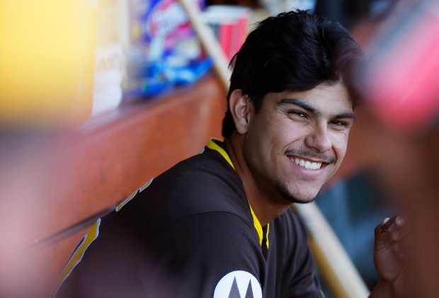 Surprise, AZ - February 21: Ethan Salas #90 of the San Diego Padres sits in the dugout during a spring training game against the Kansas City Royals on February 21, 2026 in Surprise, AZ. (K.C. Alfred / The San Diego Union-Tribune)