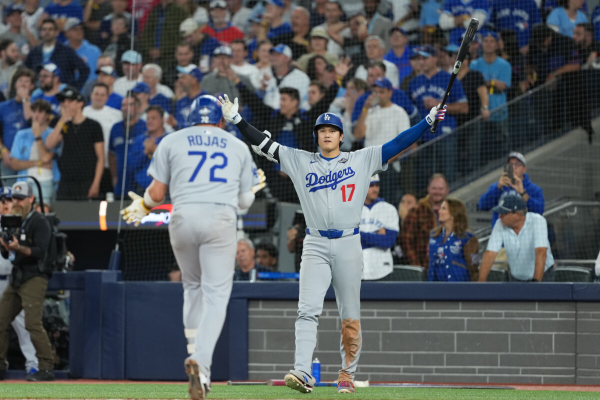 Los Angeles Dodgers superstar Shohei Ohtani meets Miguel Rojas at home plate after his World Series home run.