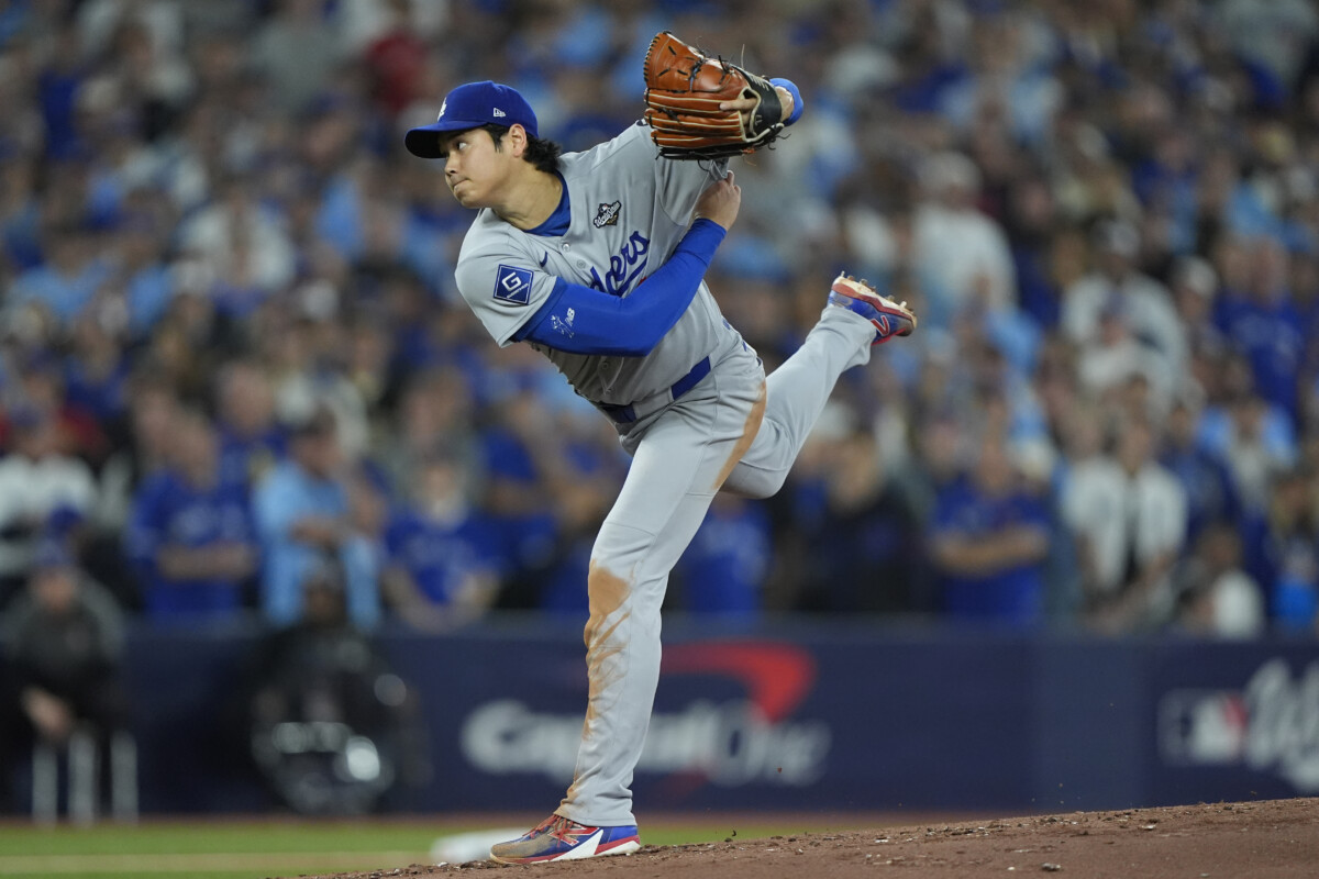Los Angeles Dodgers two-way player Shohei Ohtani (17) pitches against the Toronto Blue Jays in the second inning during game seven of the 2025 MLB World Series at Rogers Centre.