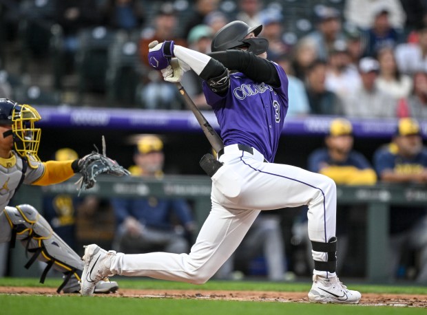 Zac Veen (13) of the Colorado Rockies takes takes a cut during his first Major League at-bat against Freddy Peralta (51) of the Milwaukee Brewers in the second inning at Coors Field in Denver on Tuesday, April 8, 2025. (Photo by AAron Ontiveroz/The Denver Post)