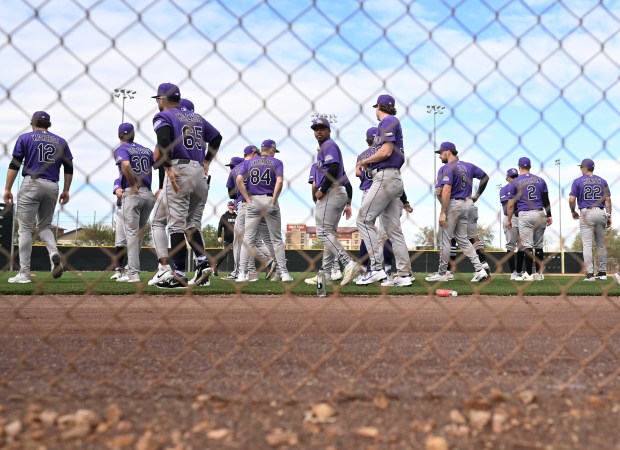 Players take the field for drills during morning practice at spring training for the Colorado Rockies at Salt River Field at Talking Stick in Scottsdale, Arizona on Feb. 18, 2026. (Photo by RJ Sangosti/The Denver Post)