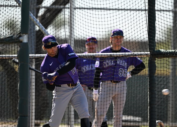 SCOTTSDALE, AZ - FEBRUARY 19: Infielder, Kyle Karros, left, takes batting practice during spring training for the Colorado Rockies at Salt River Field at Talking Stick in Scottsdale, Arizona on February 19, 2026. (Photo by RJ Sangosti/The Denver Post)